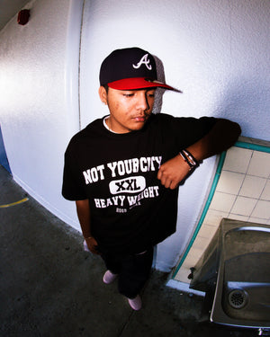 “HEAVYWEIGHT” TEE